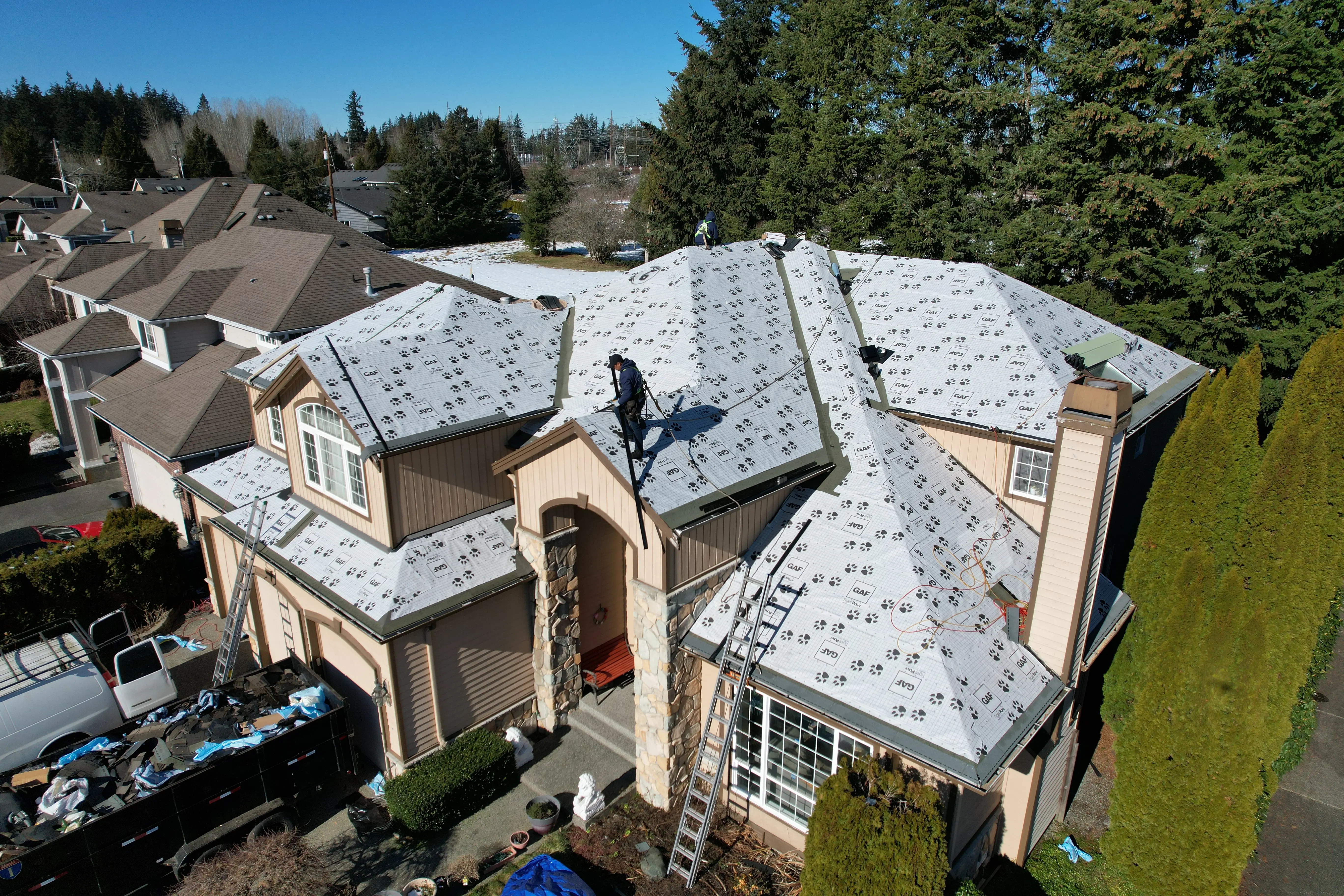 Valentin Roofing crew installing a new roof in the Seattle metro area