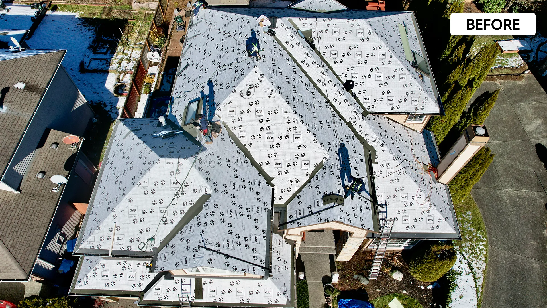 Aging roof before replacement — visible wear and damaged shingles